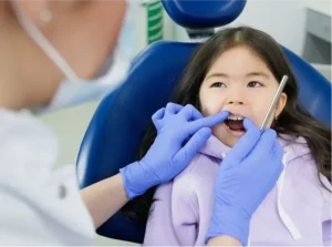 Young girl in dentist chair